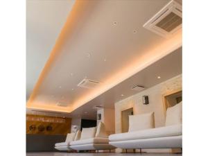 a row of white chairs in a room at Hotel Sunset Hill - Vacation STAY 94801v in Nakadomari