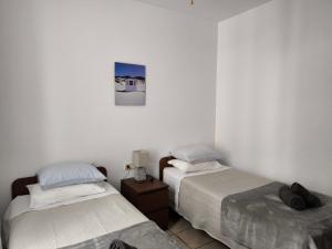 Ένα ή περισσότερα κρεβάτια σε δωμάτιο στο Apartamento playero Privado WiFi- MorroJable