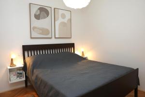 Un pat sau paturi într-o cameră la Apartman Mara
