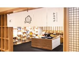 a store with a counter in a room with writing on the wall at Yunohama Hotel - Vacation STAY 94798v in Hakodate
