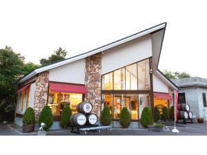 a store front of a building with large windows at Yunohama Hotel - Vacation STAY 94798v in Hakodate