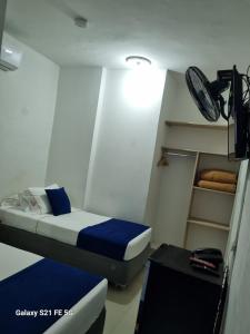 Postel nebo postele na pokoji v ubytování Hotel Casa 10