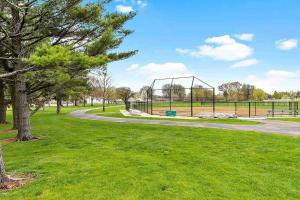 a park with a swing set in the grass at Country Studio in Aurora