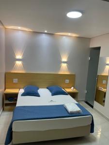 Una cama o camas en una habitación de Hotel Flert - Tatuapé