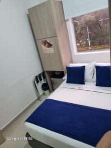 Postel nebo postele na pokoji v ubytování Hotel Casa 10