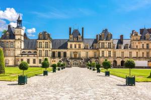 a large building with a pathway in front of it at Studio résidence touristique 3 étoiles in Le Mée-sur-Seine