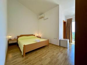 Postel nebo postele na pokoji v ubytování Guest House Maxi