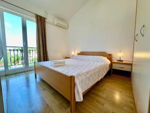 Postel nebo postele na pokoji v ubytování Guest House Maxi