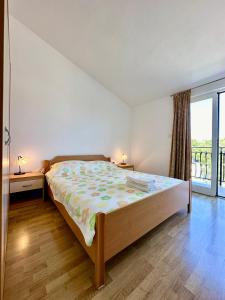 Postel nebo postele na pokoji v ubytování Guest House Maxi