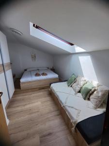 Postel nebo postele na pokoji v ubytování Apartments Tome