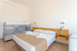 Postel nebo postele na pokoji v ubytování Hotel Katina