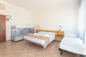 Postel nebo postele na pokoji v ubytování Hotel Katina