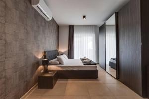a bedroom with a bed and a large window at 602 Sliema 3bed Seafront With Pool By Homely in Sliema +37 photos