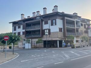 an apartment building on the corner of a street at APARTAMENTOS RioMonte 2 - DeLuxe in Boltaña