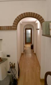 a hallway with an archway in a building at La Casa di Anita in Asti