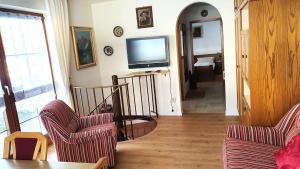 TV a/nebo společenská místnost v ubytování Ferienwohnung Schlögl