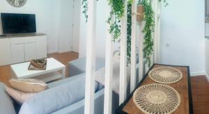 a living room with a couch and a table at Agradable casa con terraza in Las Lagunas