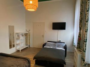 Posteľ alebo postele v izbe v ubytovaní Silentium City Apartman Sárvár