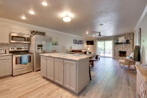 a large kitchen with a large island in the middle at Townhouse at the Mouth of Drowning Creek! in Eucha +19 photos
