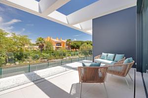 an indoor patio with a view of the outdoors at One Six Villa in Vilamoura