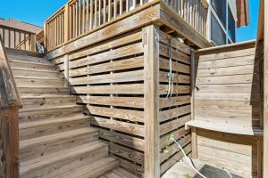 a wooden retaining wall with a wooden fence at High Seas in DeBordieu Colony home by Peace Vacations in Georgetown