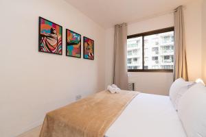Ένα ή περισσότερα κρεβάτια σε δωμάτιο στο Apartamento 2 Qto e Varanda em Condomínio Completo +74 φωτογραφίες