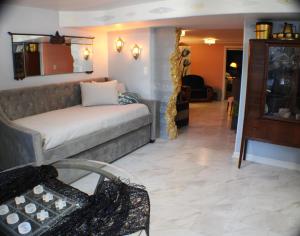 a living room with a couch and a table at The Barter Green Room in Abingdon