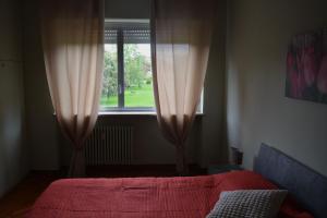 Postel nebo postele na pokoji v ubytování Gloria House