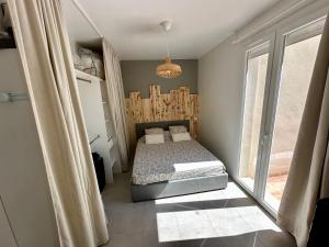 Postel nebo postele na pokoji v ubytování T2 Les Garrigues