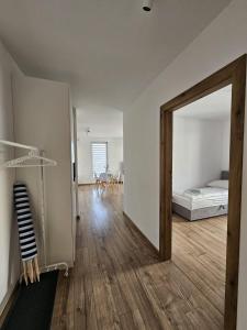 a room with a mirror and a bedroom with a bed at Apartament Cuma - zacumuj w Pucku in Puck +16 photos