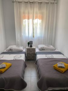 Posteľ alebo postele v izbe v ubytovaní Apartamento PARADISE Solo Familias