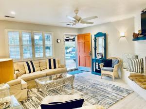 a living room with a couch and a table at Endless Beach #A,Oceanfront,3bedrooms-2bath-Pet Friendly in Virginia Beach