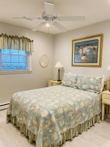 a bedroom with a bed and a ceiling fan at Endless Beach #A,Oceanfront,3bedrooms-2bath-Pet Friendly in Virginia Beach