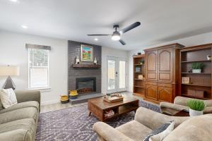 a living room with a couch and a fireplace at South Austin Life in Austin