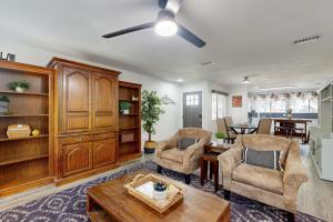 a living room with two chairs and a table at South Austin Life in Austin