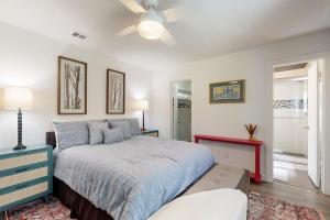 a bedroom with a bed and a ceiling fan at South Austin Life in Austin