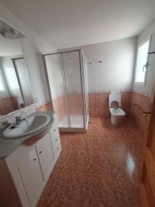 a bathroom with a shower and a sink and a toilet at Apartamento para 6 personas en Alcalá de Xivert in Alcalá de Chivert +7 photos