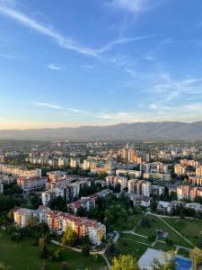 an aerial view of a city with buildings at Royal Kate SPA included, 32nd floor in Skopje