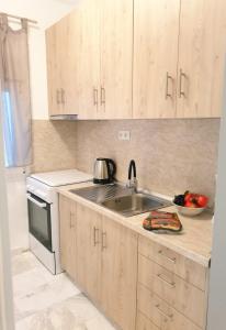Η κουζίνα ή μικρή κουζίνα στο Aeria old port apartment 1 +23 φωτογραφίες