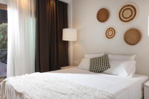Postel nebo postele na pokoji v ubytování Hotel Magdalena