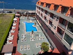 Bazén v ubytovaní Hotel La Lanzada alebo v jeho blízkosti