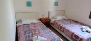 Postel nebo postele na pokoji v ubytování Kaiti Villa 4