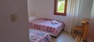 Postel nebo postele na pokoji v ubytování Kaiti Villa 4