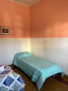 Ένα ή περισσότερα κρεβάτια σε δωμάτιο στο Alojamiento en La Falda - MSL