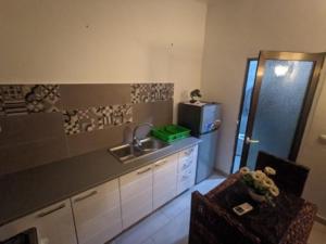 a kitchen with a sink and a counter top at Magnifique studio à Mpita in Pointe-Noire
