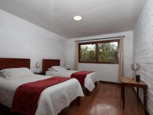 Postel nebo postele na pokoji v ubytování Apartamentos Otorongo Cuenca Ecuador