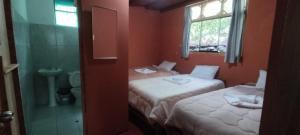 Ένα ή περισσότερα κρεβάτια σε δωμάτιο στο Etrita Inkas Hostel