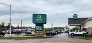 a sign in a parking lot in front of a dealership at Quality Inn & Suites Somerset Downtown in Somerset