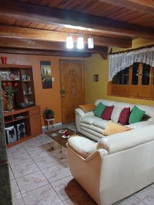 a living room with two couches and a table at Depa amoblado Samana Cruz in Cajamarca