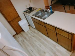 a kitchen with a sink and a counter at Golden Sunflower's Apt A in Lawton +21 photos